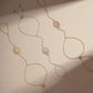 three adjustable hand chain bracelets, one gold hand chain, a rose gold ring bracelet, and a silver slave bracelet