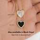 woman holding two necklaces of the mother of pearl and black onyx style variations available for this heart pendant necklace