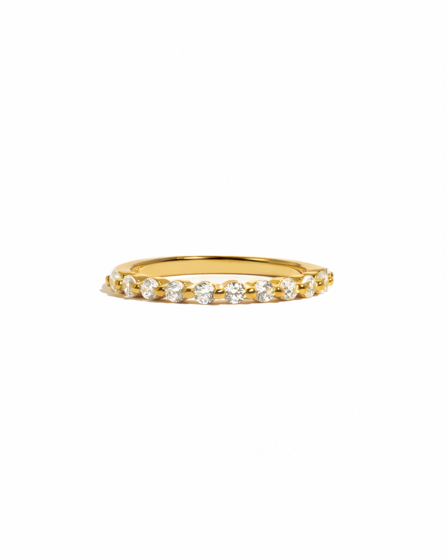 Gold stacking ring on white background