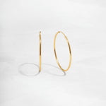 Closeup image of thin hoop earrings