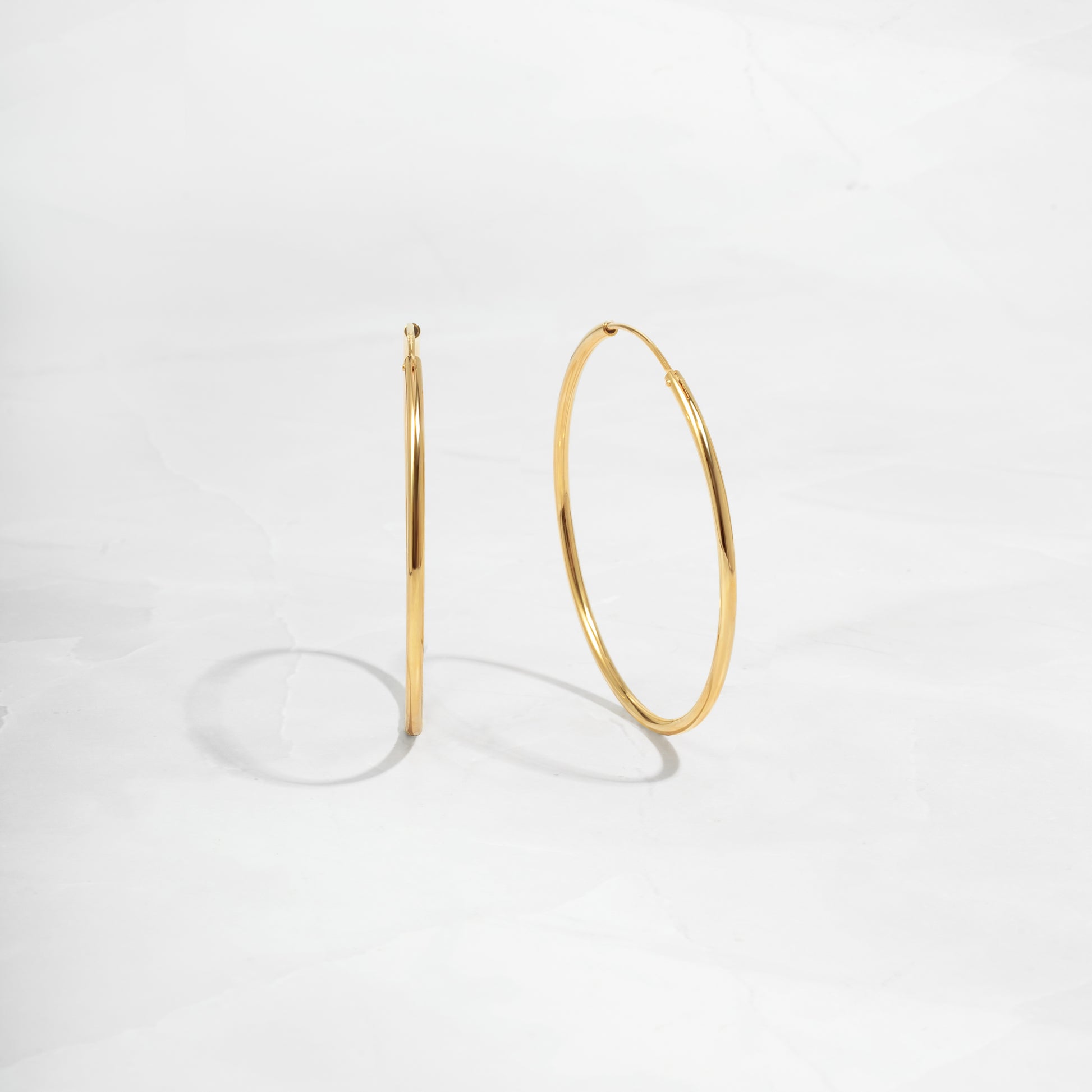 Closeup image of thin hoop earrings