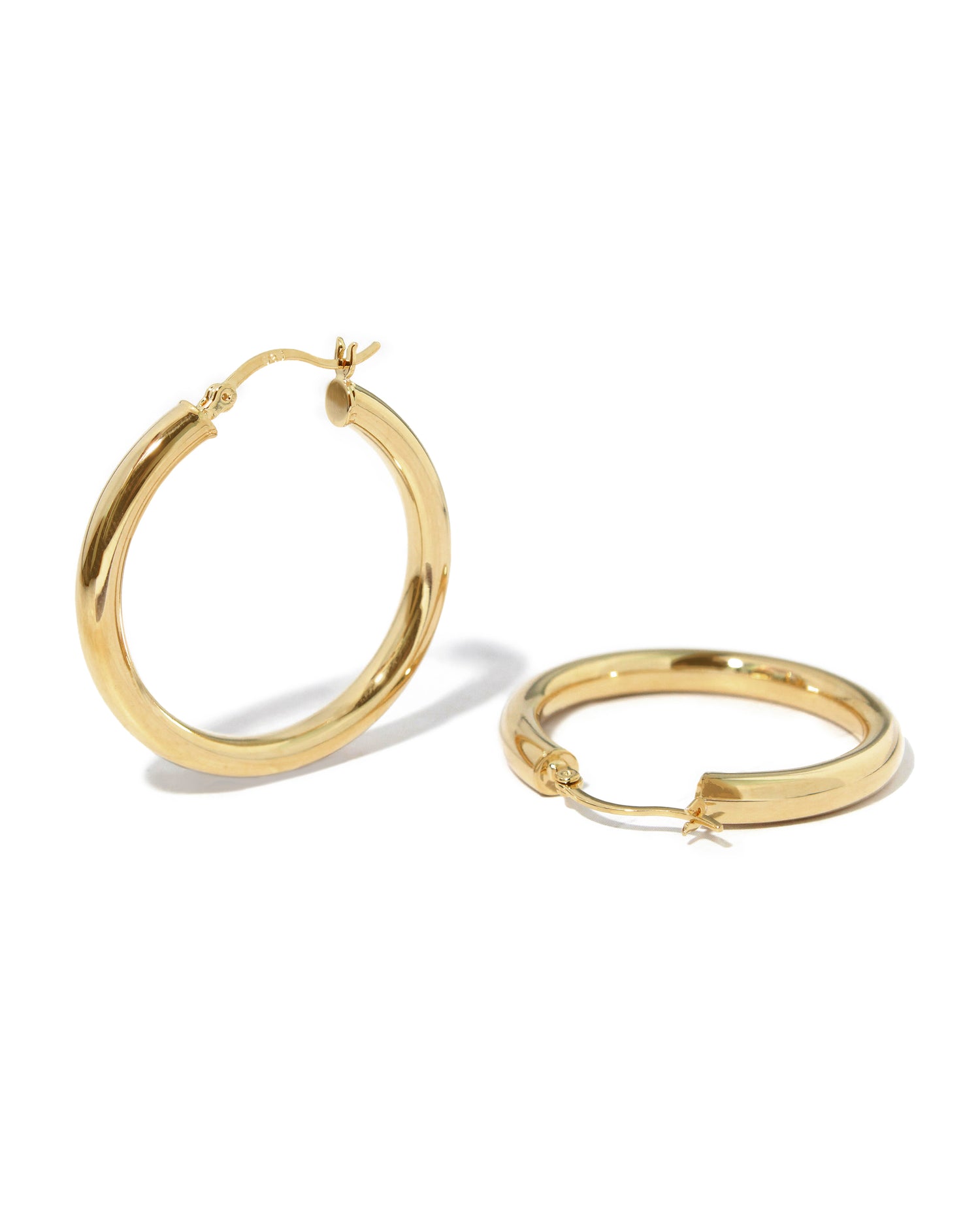Lightweight chunky hoop earrings, classic madison beer hoop earrings on white backround