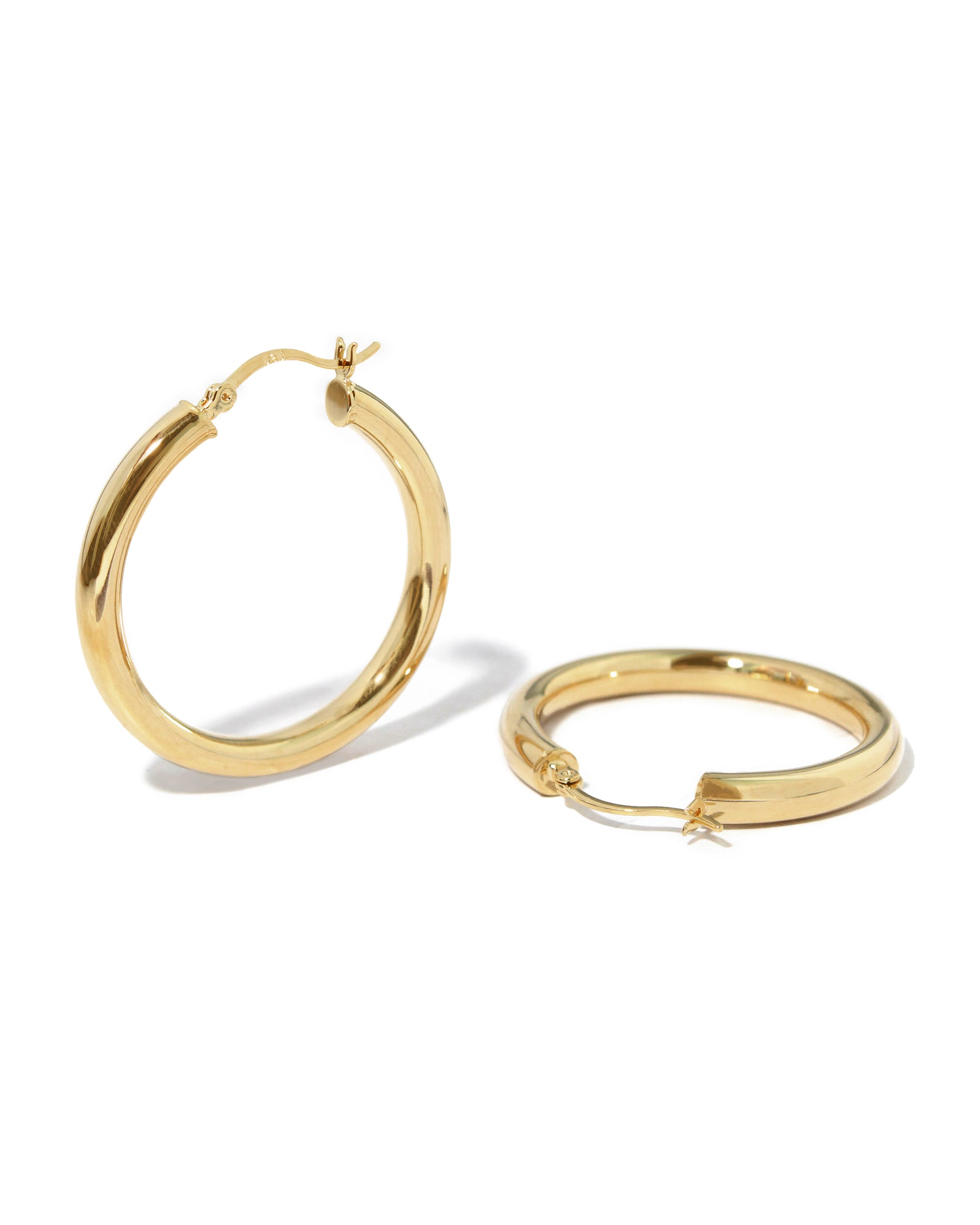 Lightweight chunky hoop earrings, classic madison beer hoop earrings on white backround