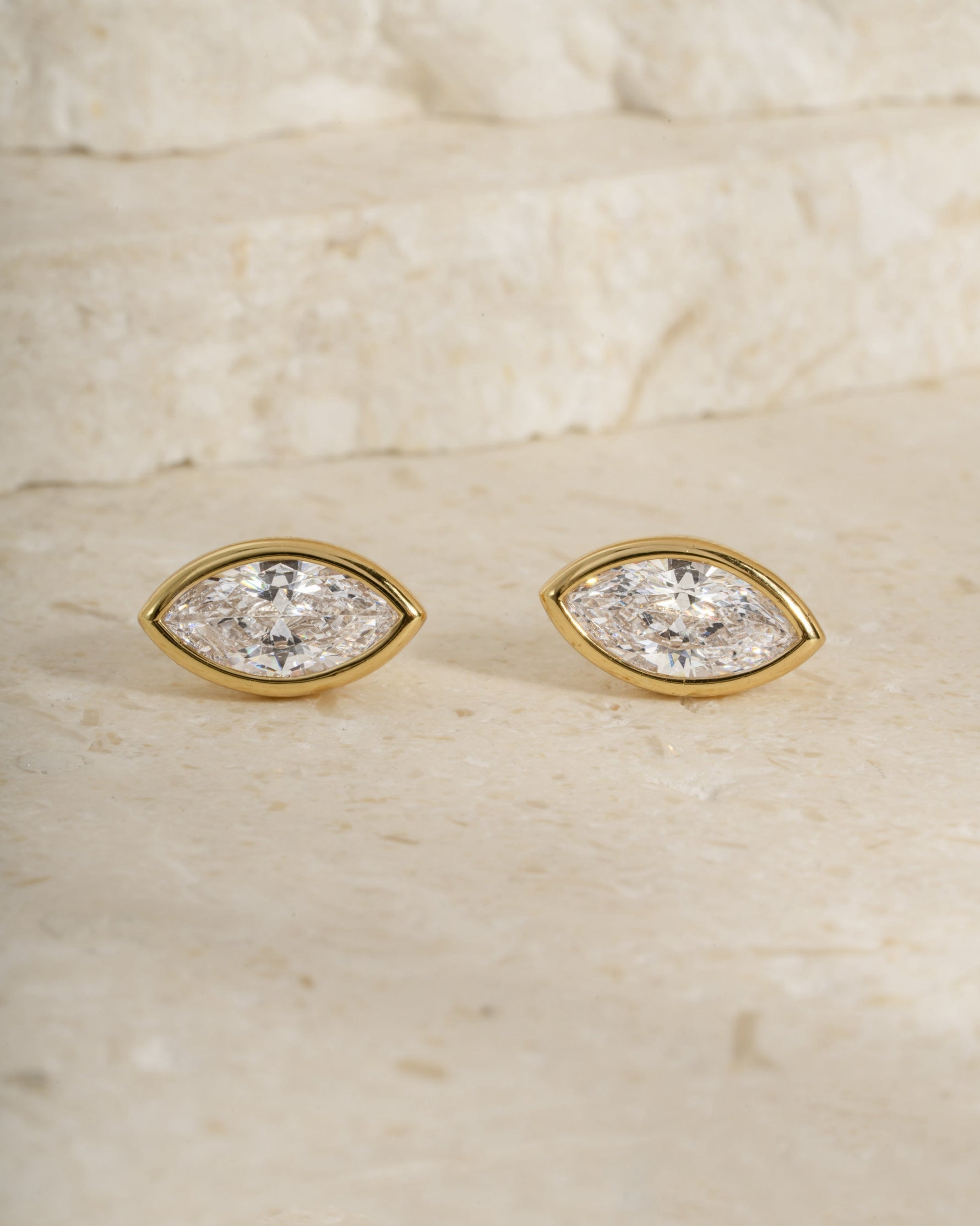 Pair of gold diamond earrings, perfect for bridal jewelry