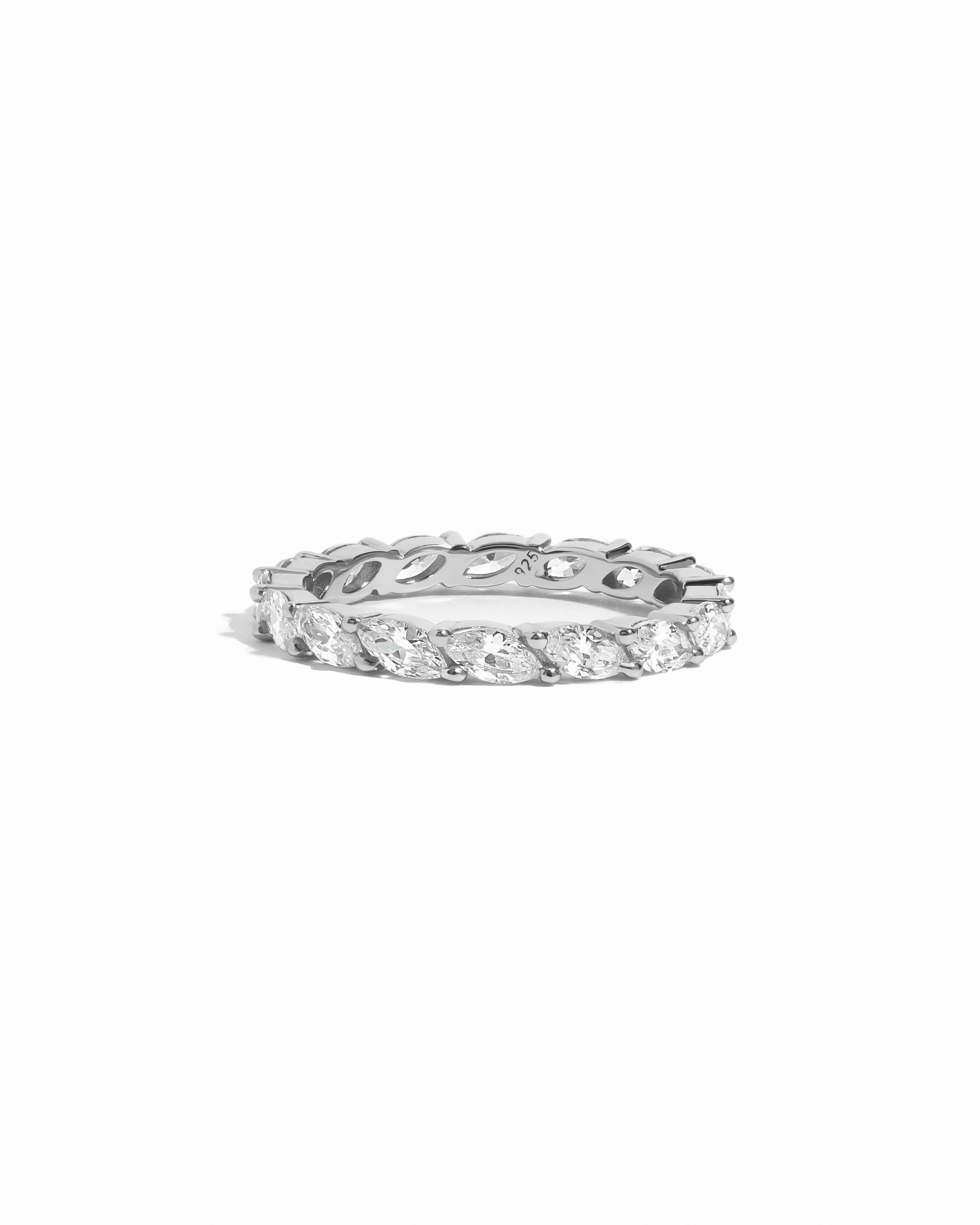 flat lay of minimalist ring as a wedding band alternative that offers timeless elegance with a modern marquise twist, set in sterling silver. 