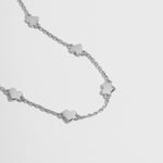 Sterling silver heart bracelet laid flat, ideal as a friendship bracelet or prom jewelry. 