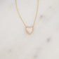 A detailed close-up of the gold diamond necklace, laid flat, highlighting the mother of pearl’s intricate details.