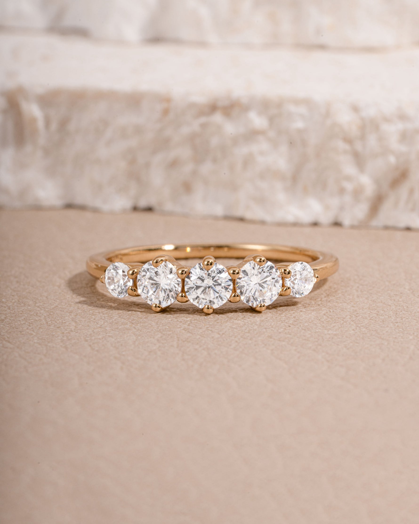 Gold wedding ring with multiple cubic zirconia stones