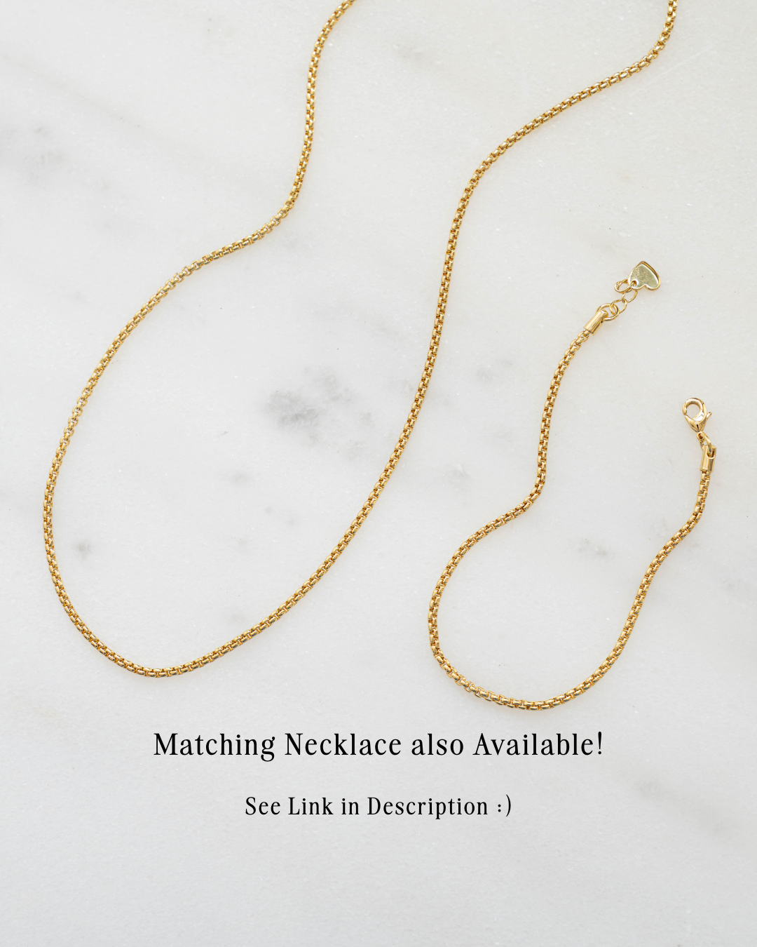 Gold chain necklace on a marble surface with text about a matching necklace.
