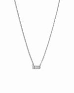 Silver baguette stone necklace on a white background