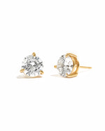 Cubic zirconia gold plated earrings on a white background
