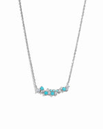 silver chain with turquoise pendant and cz and turquoise stones on a white background