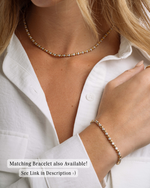 Image showcasing a diamond two tone tennis necklace and a matching diamond bracelet on model