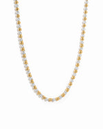 Two-tone tennis necklace on a white background
