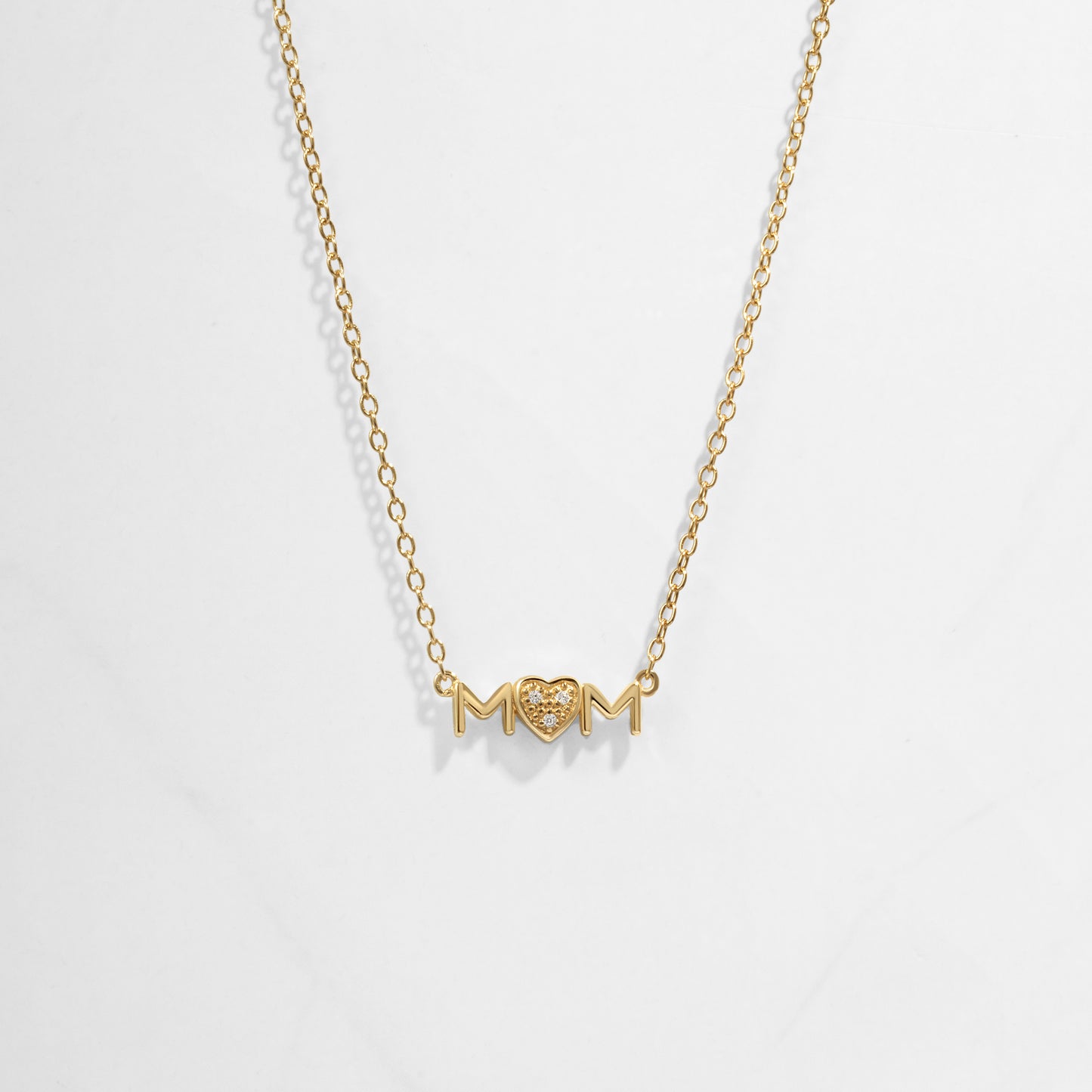 Closeup image of gold heart necklace for her