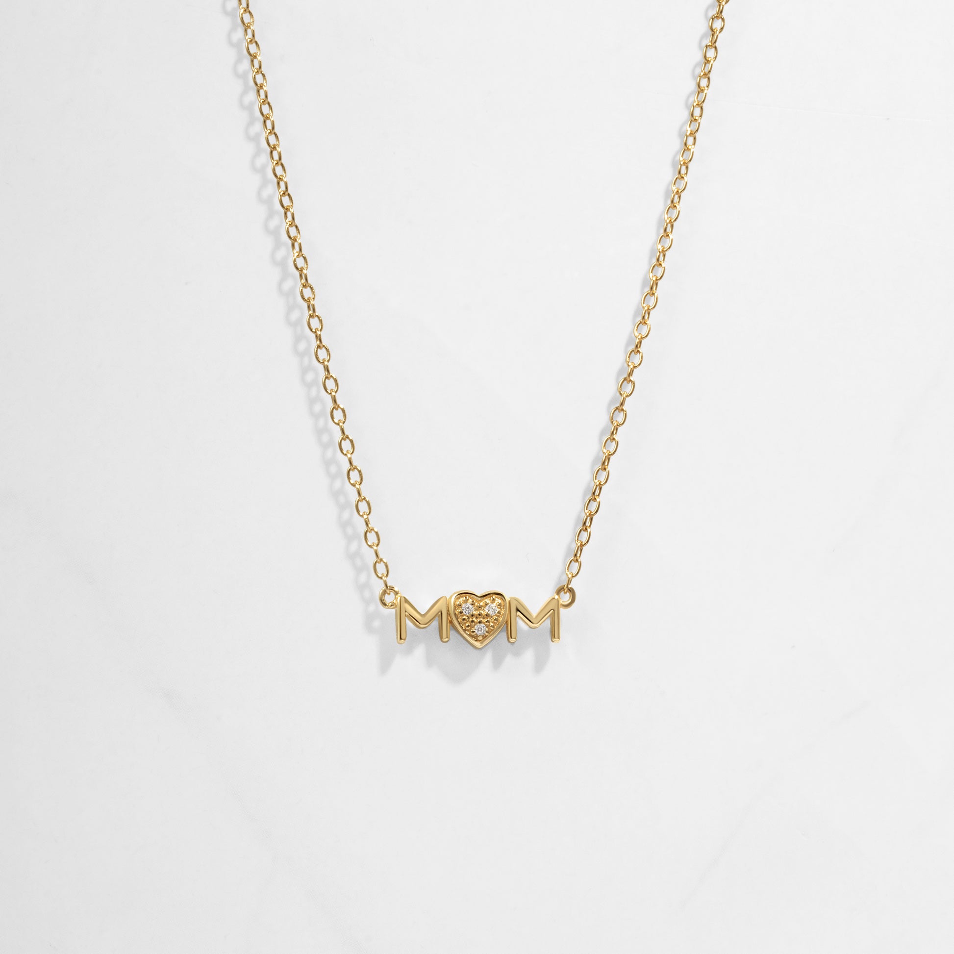 Closeup image of gold heart necklace for her