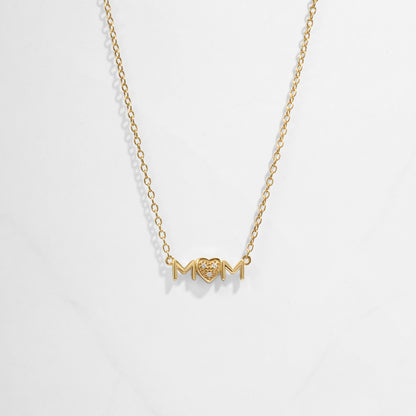 Closeup image of gold heart necklace for her