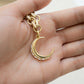 models hand showcasing diamond necklace with moon pendant