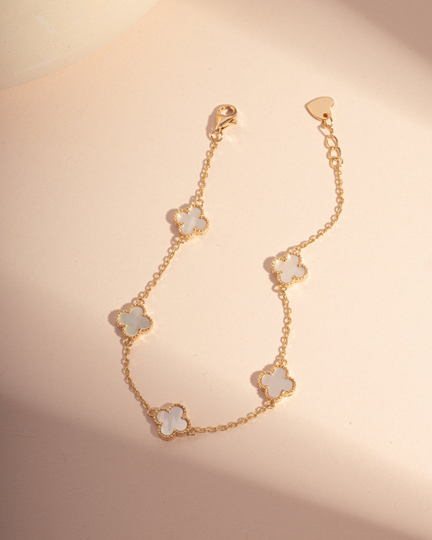 gold four leaf clover stackable chain bracelet with mother of pearl charms