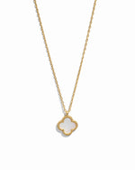 Gold necklace with a clover-shaped pendant set with mother of pearl on a white background