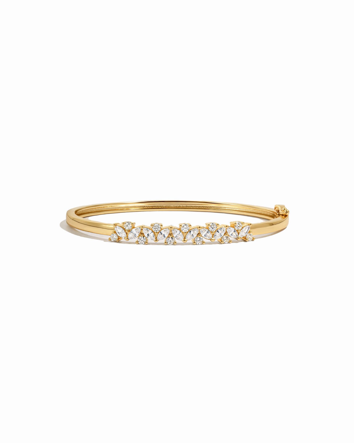 Gold diamond bangle bracelet on a white background