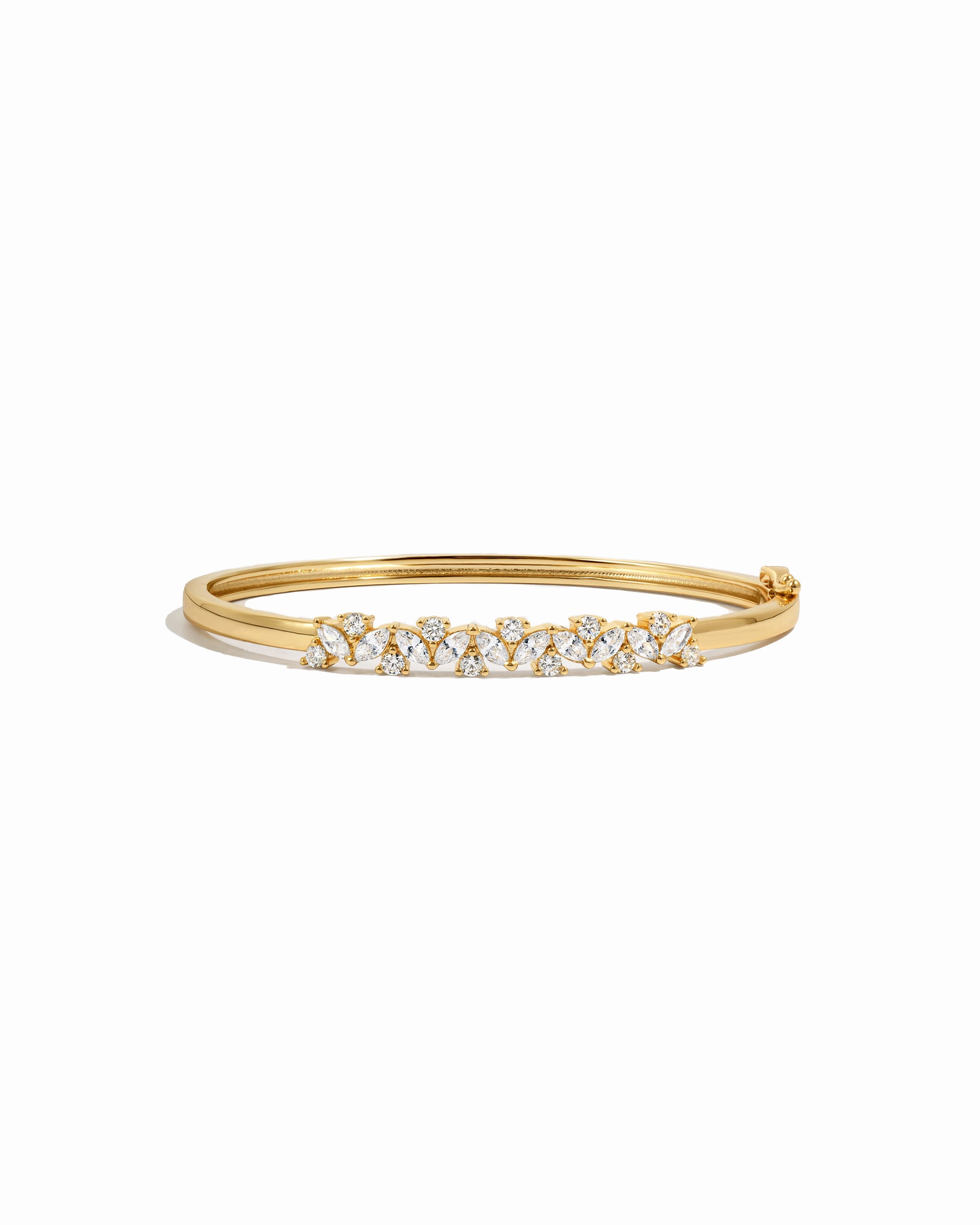 Gold diamond bangle bracelet on a white background