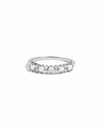 Silver ring with opal  and cz stones on a white background