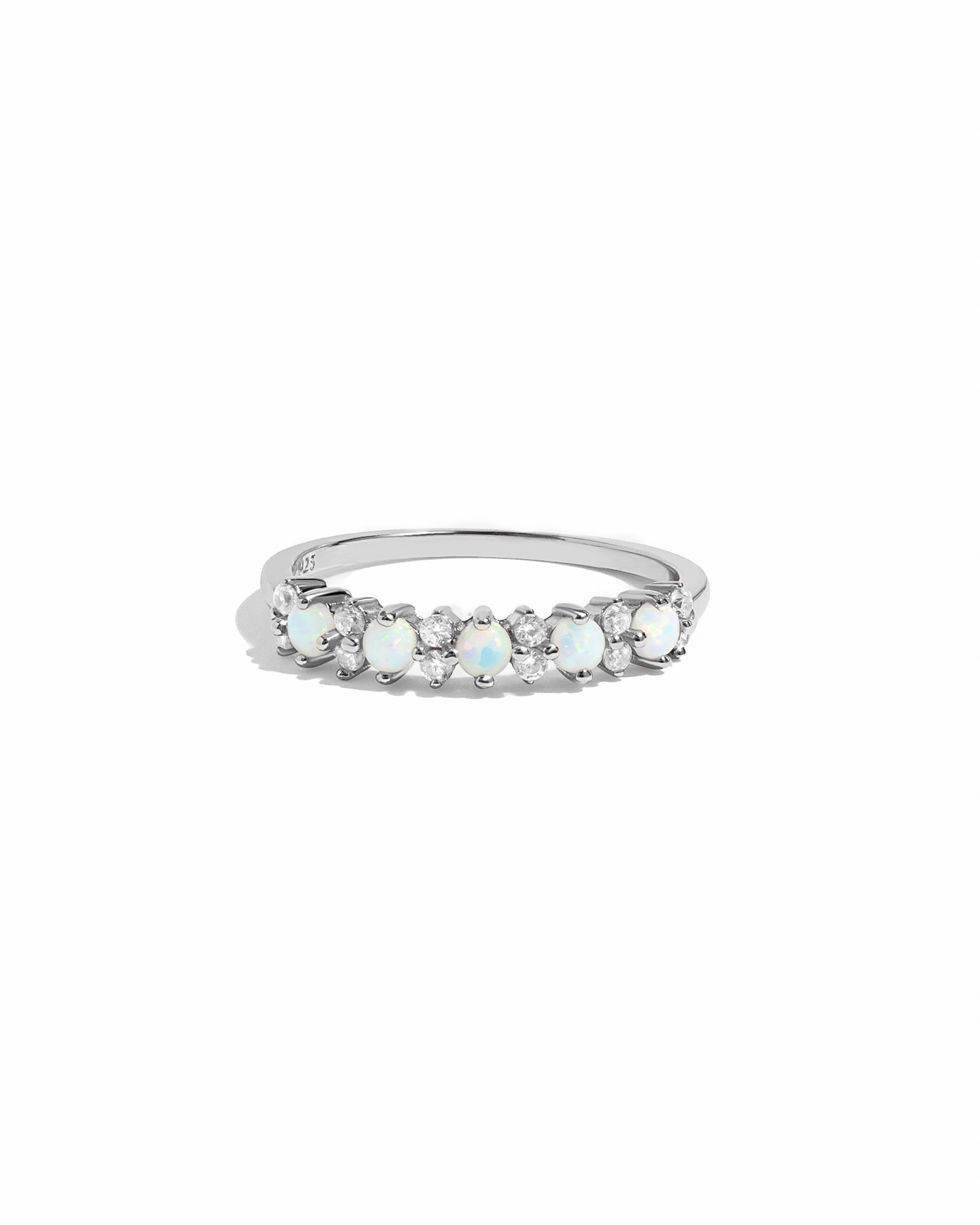 Silver ring with opal  and cz stones on a white background