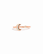 closeup image of rose gold opal moon ring