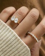 Gold oval statement ring and marquise cut stackable ring on model