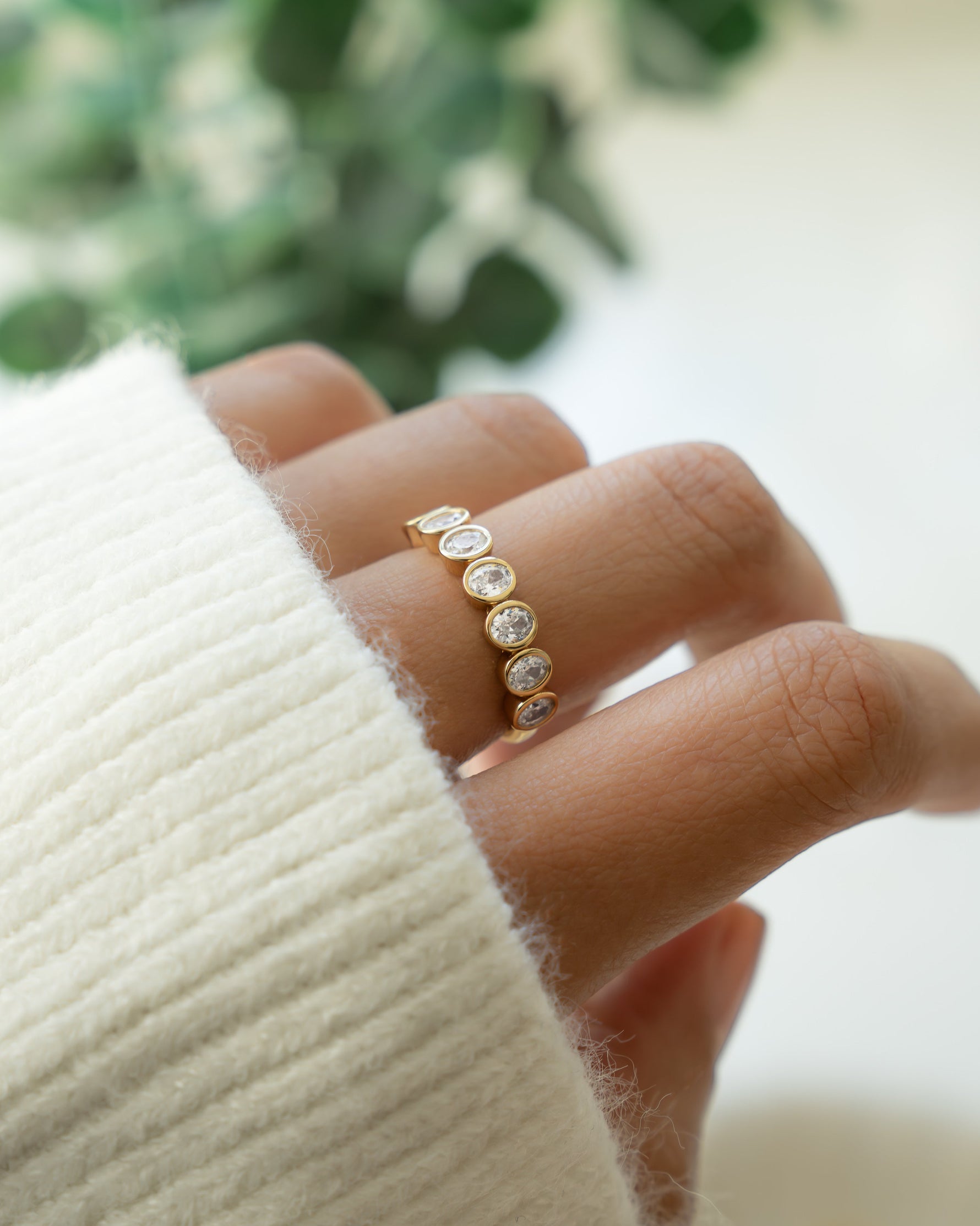 Model wearing gold bezel vintage ring 