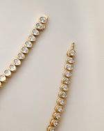 gold oval diamond tennis bracelet with box clasp closure