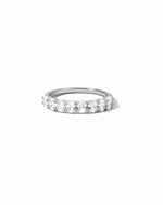 Silver ring with oval diamonds on a white background
