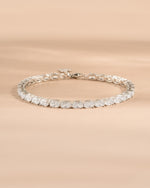 Sterling silver diamond bracelet for women on a neutral background 