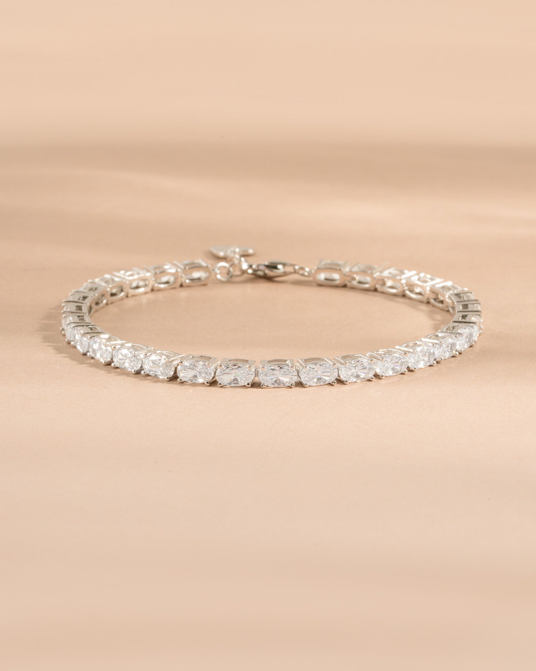 Sterling silver diamond bracelet for women on a neutral background 
