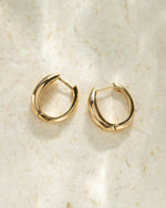 Dainty gold huggie earrings