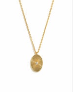 oval medallion necklace with fluted design