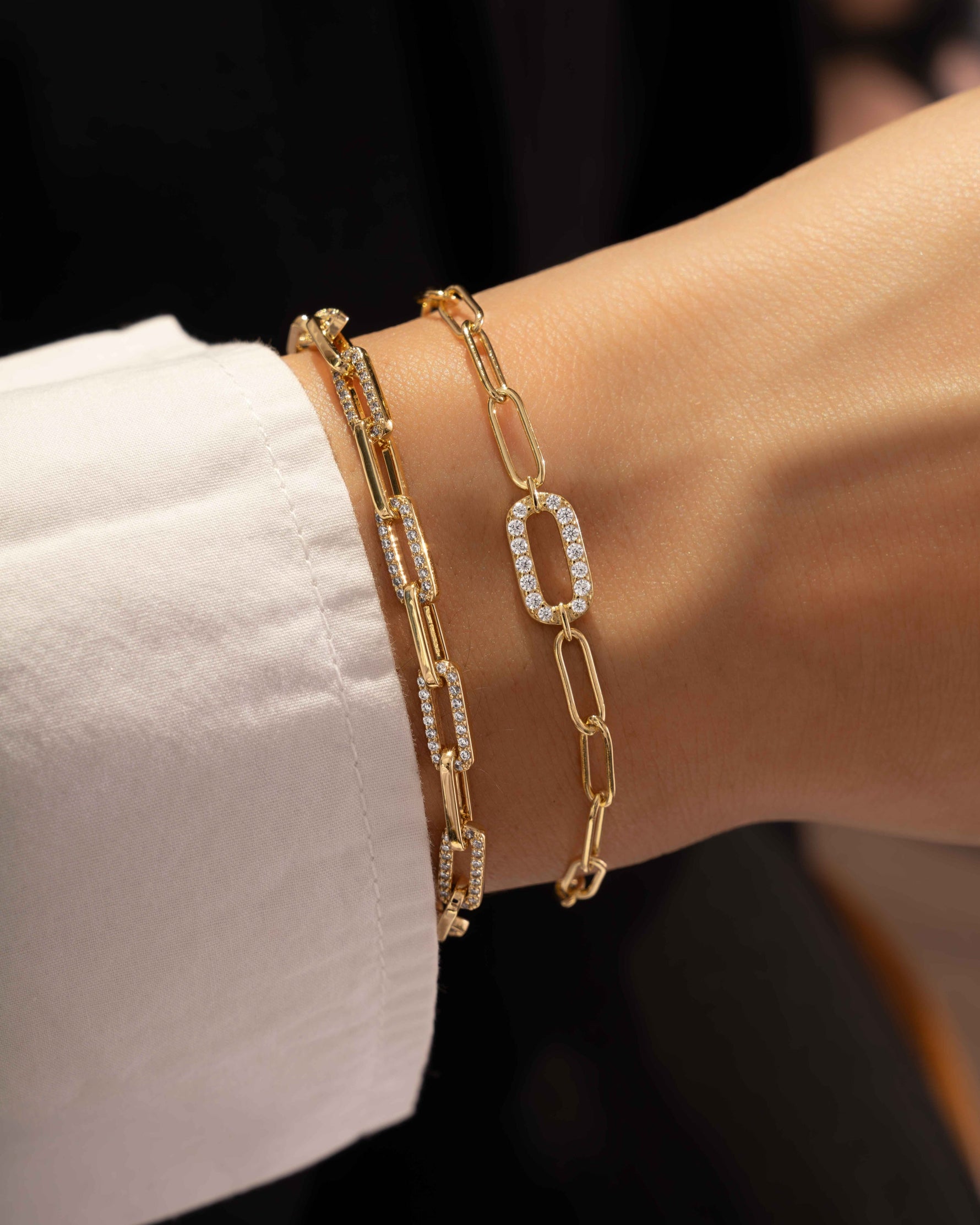 model wearing paperclip bracelets with cubic zirconia diamonds