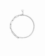 closeup image of silver bracelet with tennis chain and paperclip chain