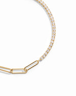 closeup image of gold bracelet with tennis chain and paperclip chain