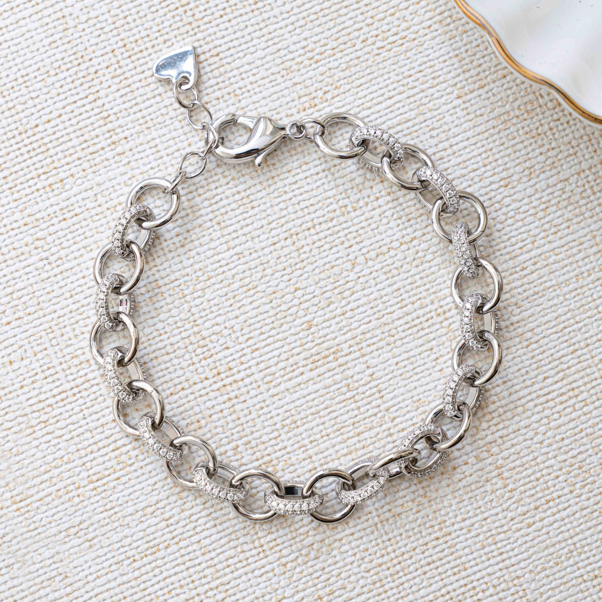 Closeup image of silver chain with chunky jewelry design