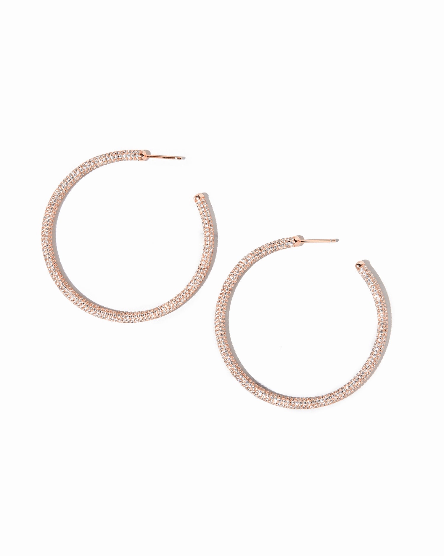 Rose gold hoop earrings on a white background