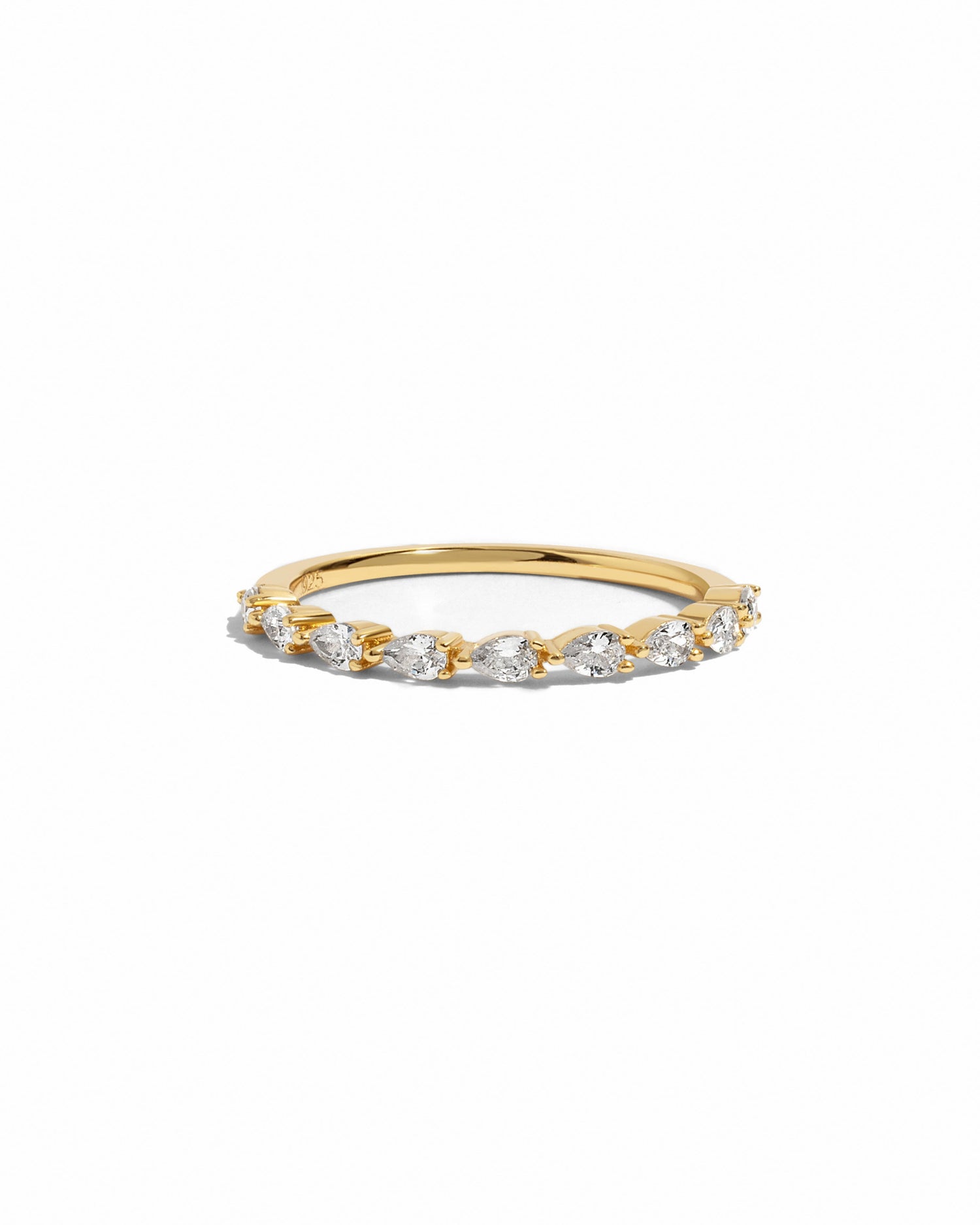 Gold ring with pear shaped diamonds on a white background
