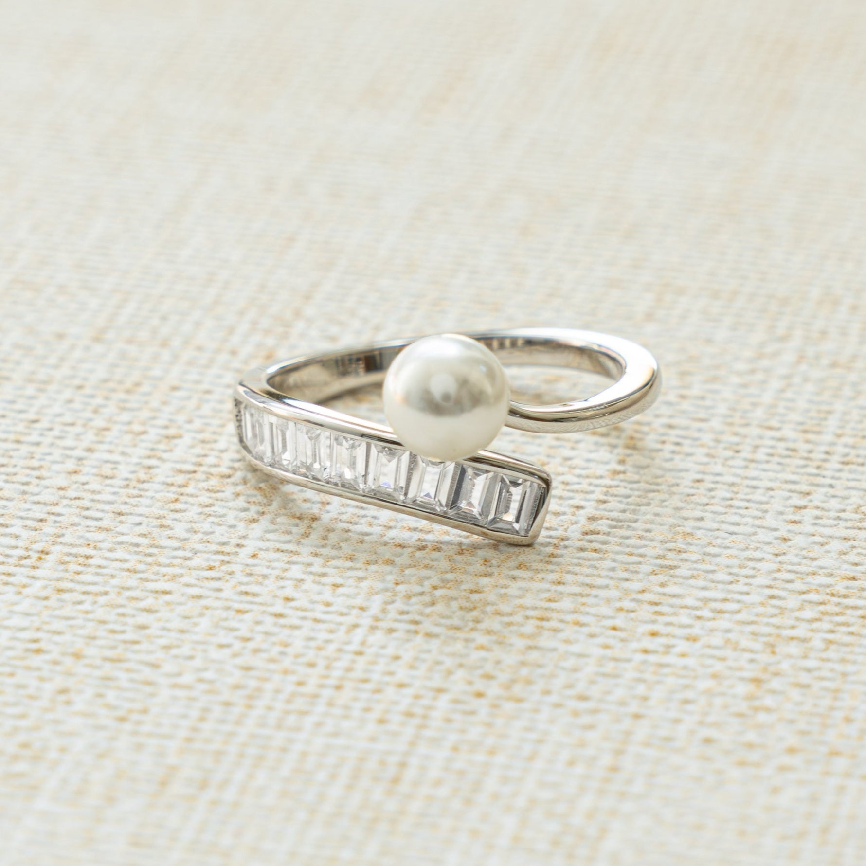 spiral pearl stacking ring with baguette ring design in sterling silver