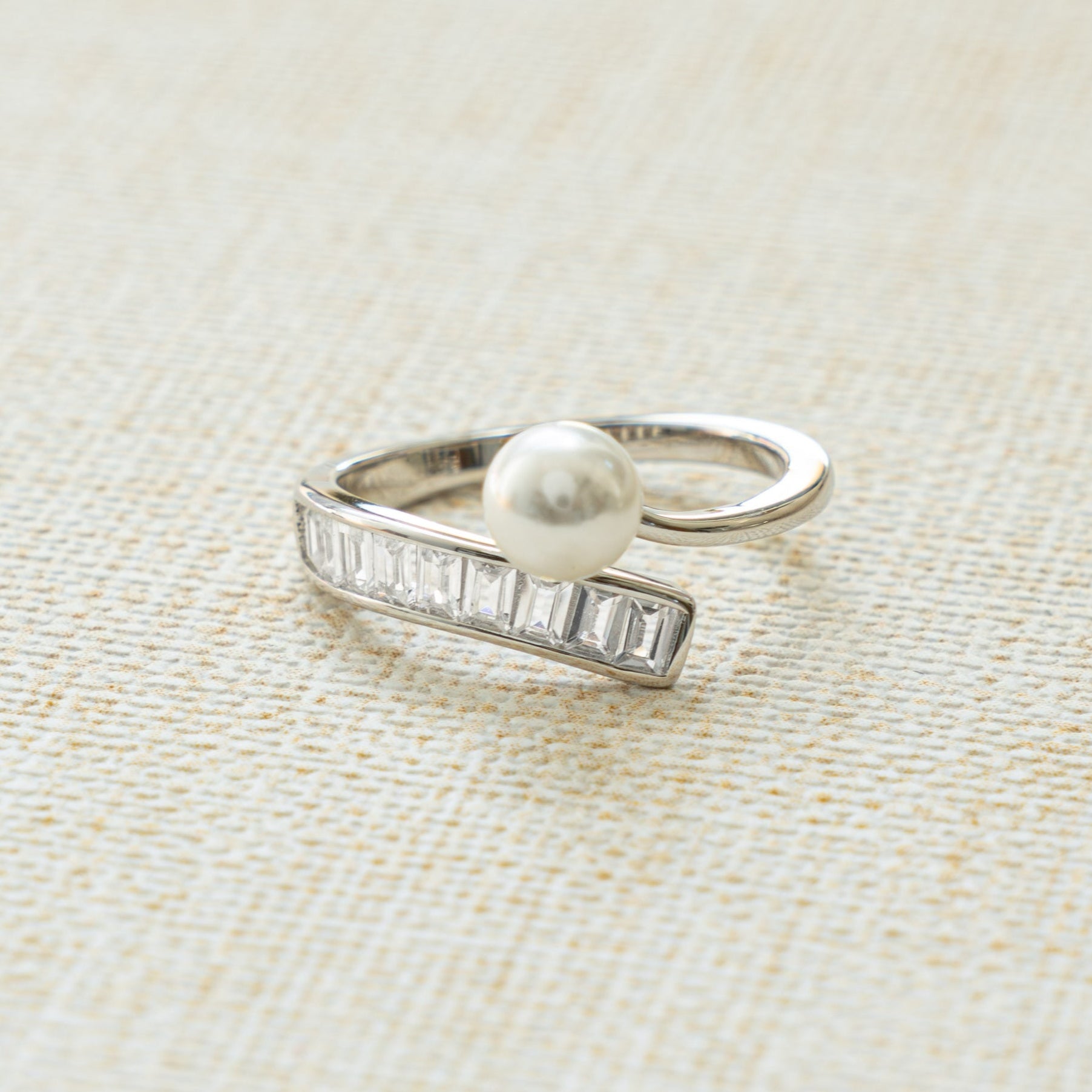 spiral pearl stacking ring with baguette ring design in sterling silver