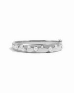 closeup image of silver pearl bangle