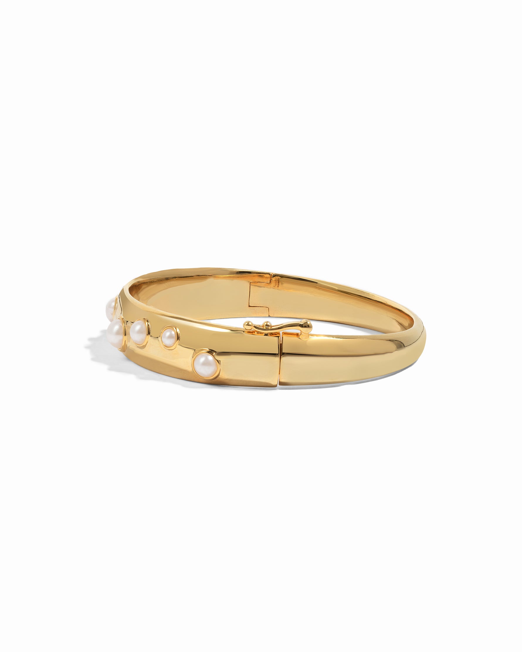 gold bangle bracelet with studded pearl design