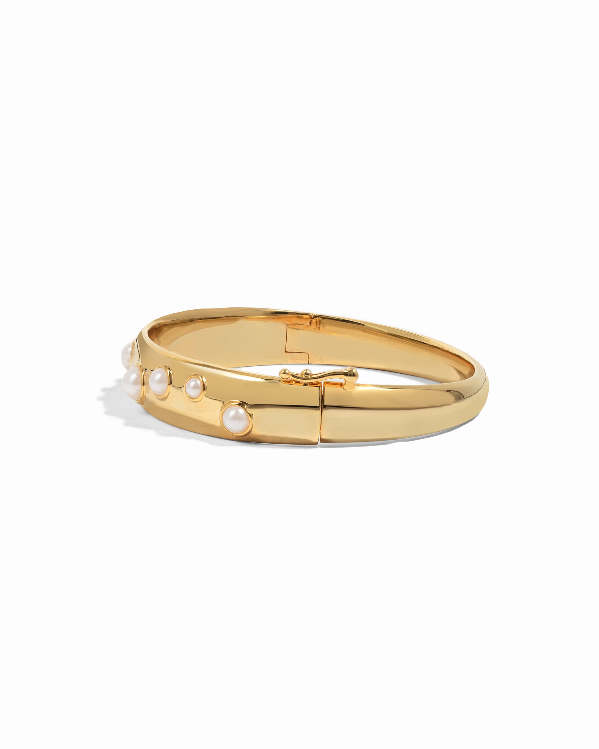 gold bangle bracelet with studded pearl design