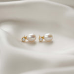 side view of diamond pearl drop earrings in gold 