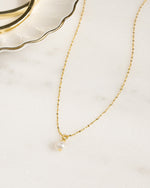 Gold necklace chain with a freshwater pearl pendant